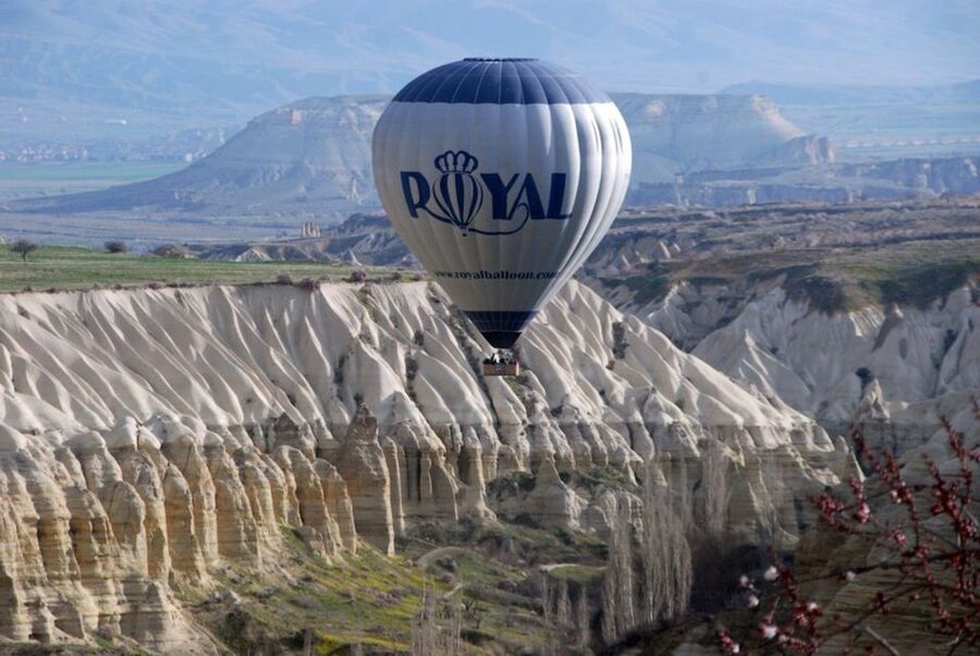 Cappadocia: Royal Queen Hot Air Balloon Tour at Sunrise - The 300-Meter Climb Over Valleys and Rock Formations