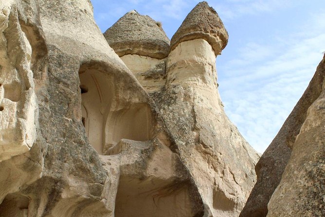 Highlights of Cappadocia Tour (Private) - Pigeon Valley: the Uçhisar view framed through nazar boncuk